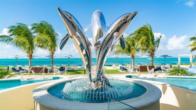 Beachfront at Windsong on the Reef water fountain dolphin statue