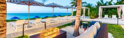 Beachfront at Windsong lounge chairs and fire pit